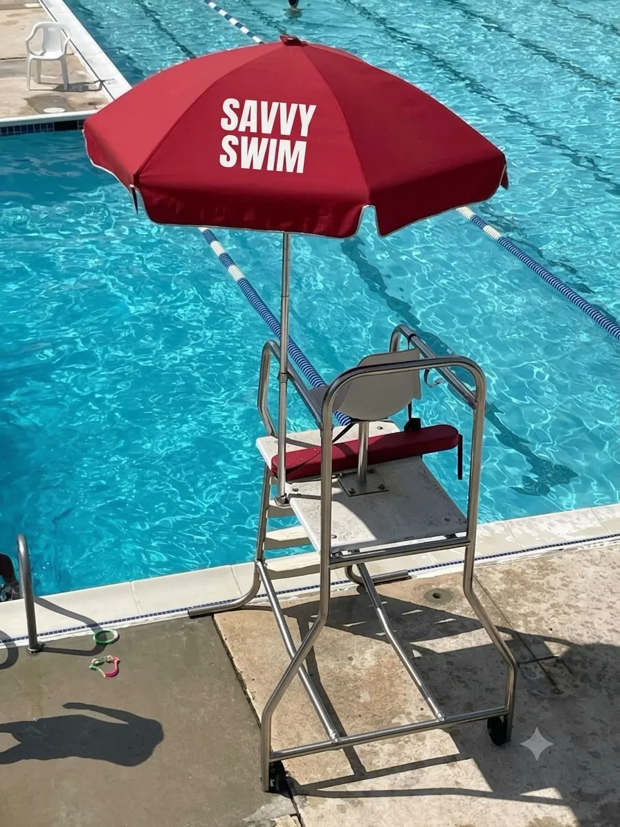 Savvy Swim branded lifeguard umbrella at a pool deck